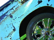Shiny Rims on Rusty Truck